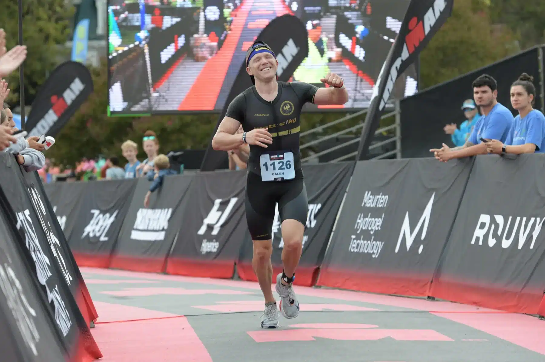 Galen McNaughton approaching an Ironman finish line