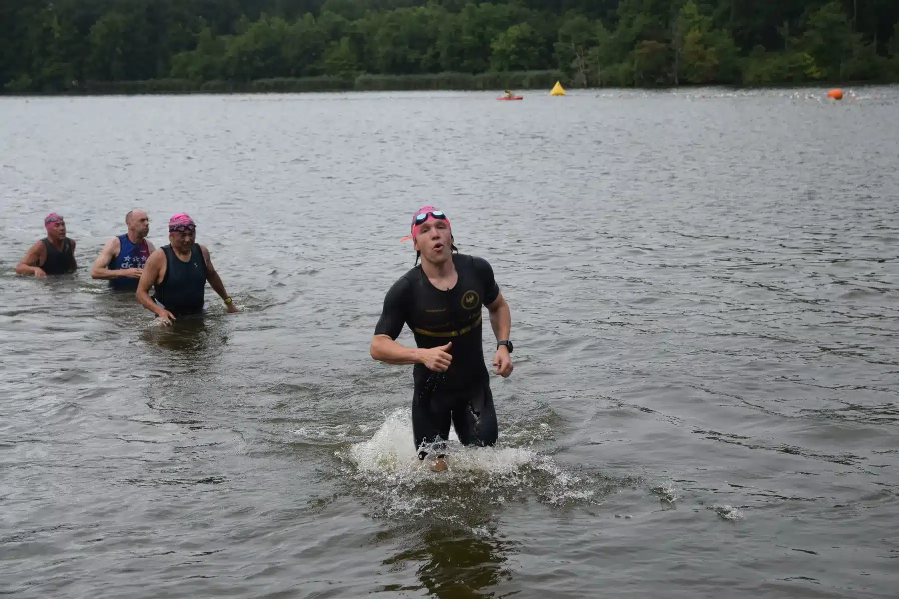 Galen McNaughton exiting the water during a triathlon swim